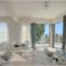 Breakfast area with a balcony area with sea and garden views