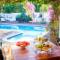 Breakfast & Dinner is available on the veranda around the swimming pool.
