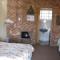 En-suite bathroom with shower, basin and toilet