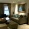 Lounge: new curtains, wooden rods, newly manufactured furniture and shaggy rug.