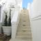 Hand painted grapes on handmade porcelain tiles for an exterior staircase in Stellenbosch.