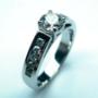 Claw and channel set diamond engagement ring