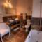 En-suite bathrooms with bath and his and her vanities.