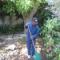 Simphiwe is cleaning a backyard