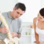 Chiropractor explaining the condition to patient