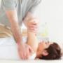 Chiropractor treating patient