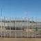 Palisade Fence with electric Fence attached.