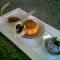 Coconut cake with caramelised grapefruit,blueberry mousse and plum sorbet