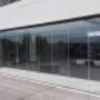 Frameless sliding stacking doors