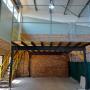 Mezzanine floor with handrails and staircase.