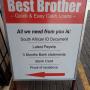 SIgnboard outside store at entrance doors