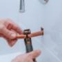 copper pipe cutting in bathroom Plumbers Network