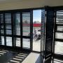 Dark shutters installed by Western Screens