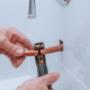 copper pipe cutting in bathroom Plumbers Network.jpg