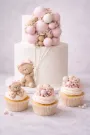 Teddy bear cake with matching cupcakes.  Frost