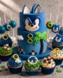 Blue Sonic custom themed cake combo with matching cupcakes and cake pops.  Frost